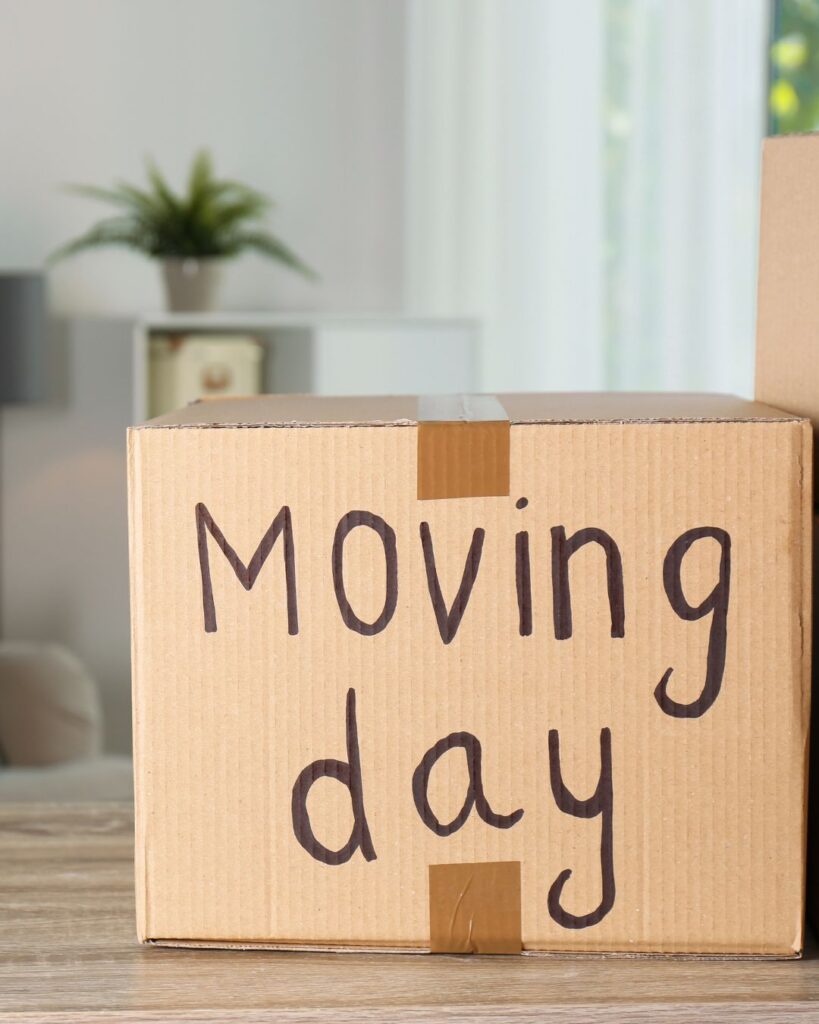 Packed Box with Moving Day written on it
